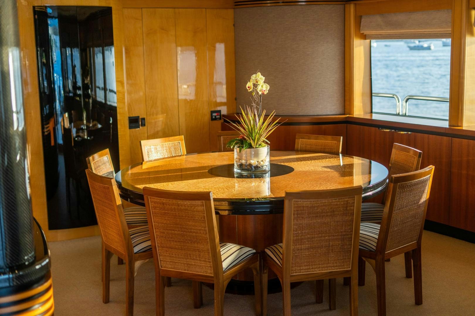 a dining table with chairs around it aboard MY SPIRIT Yacht for Sale