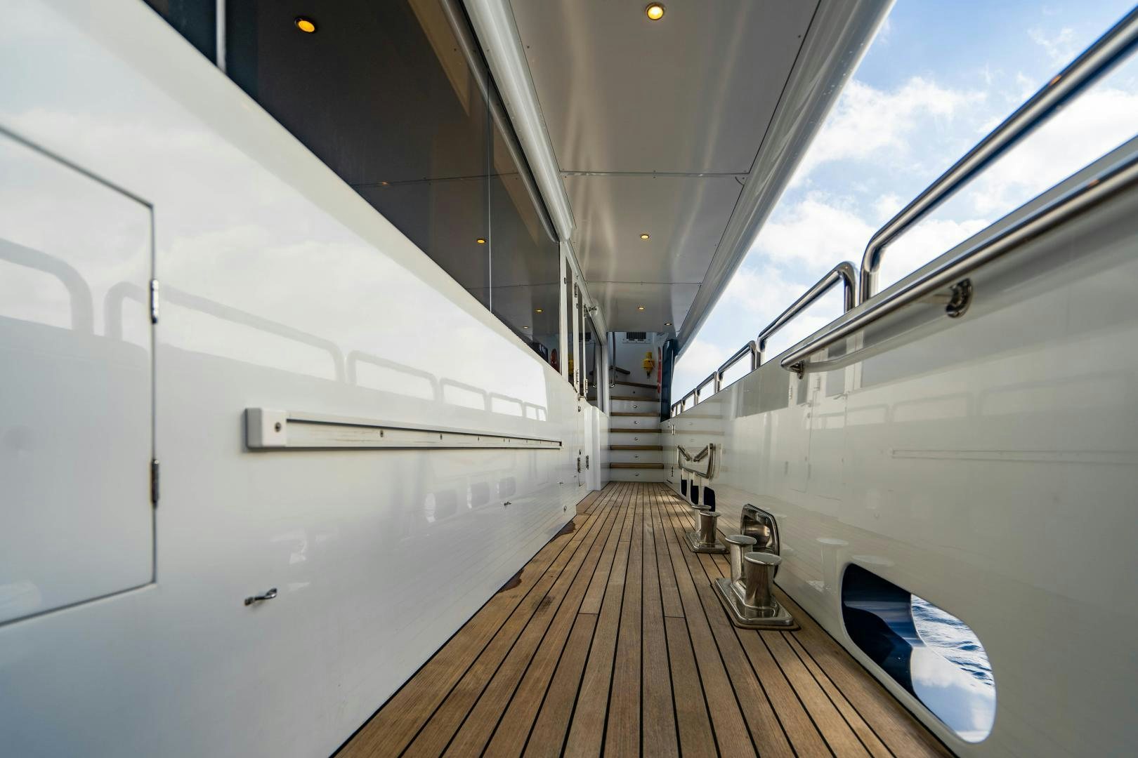 a long hallway with a white wall aboard MY SPIRIT Yacht for Sale