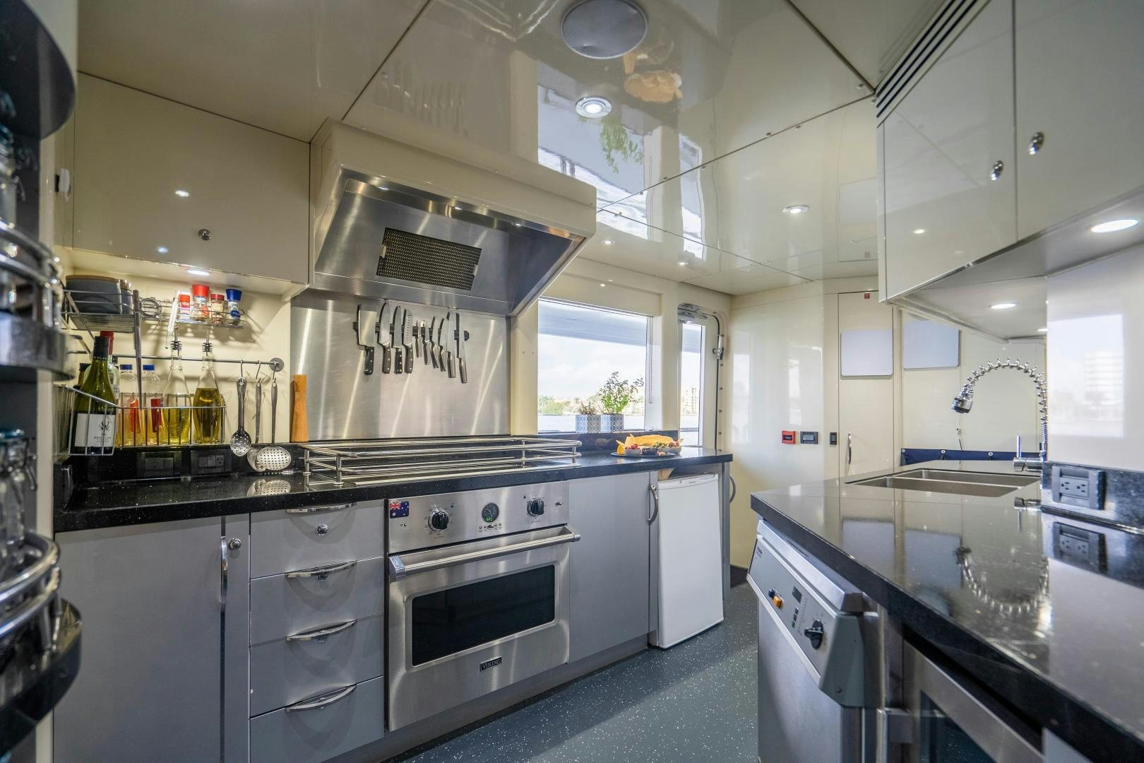 a kitchen with white cabinets aboard MY SPIRIT Yacht for Sale