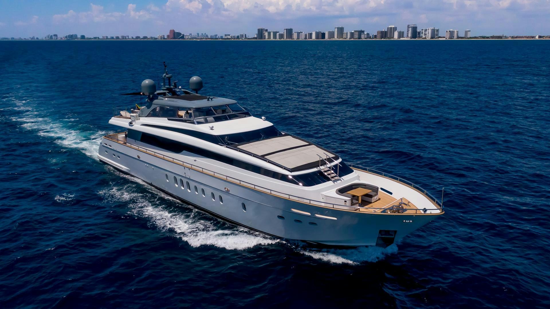 a white yacht on the water aboard BAD ROMANCE IV Yacht for Sale