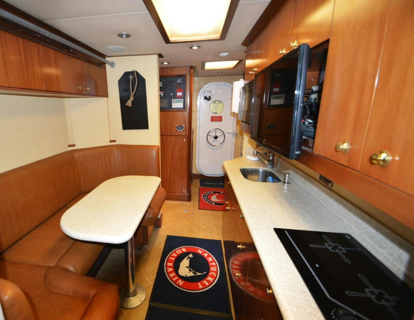 a kitchen with a bar and a bar aboard MARBRI Yacht for Sale