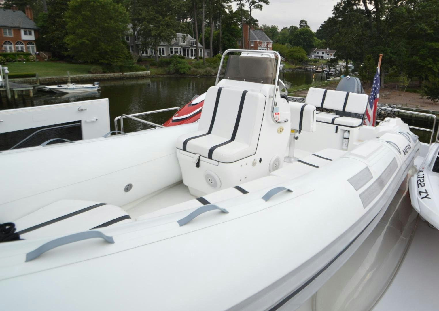 a boat with a flag on the front aboard MARBRI Yacht for Sale
