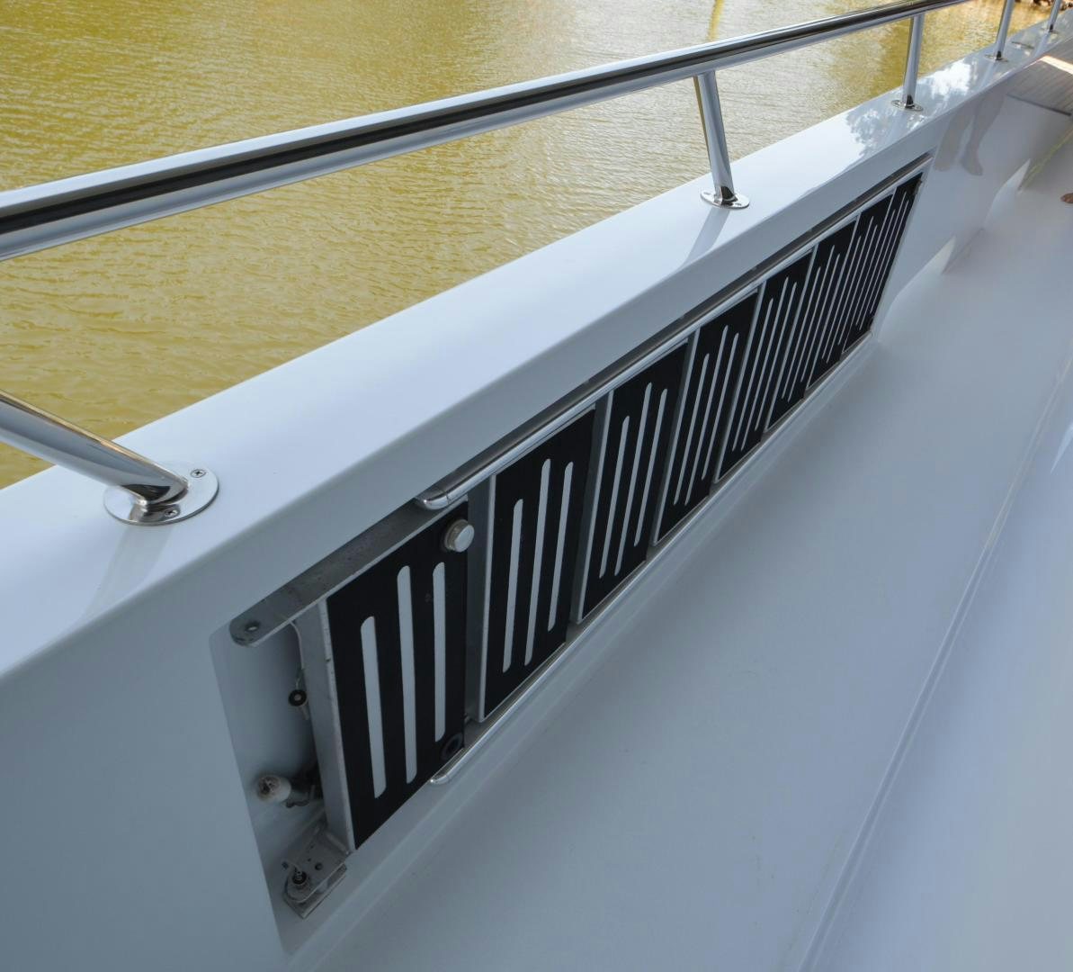 a close-up of a white piano aboard MARBRI Yacht for Sale