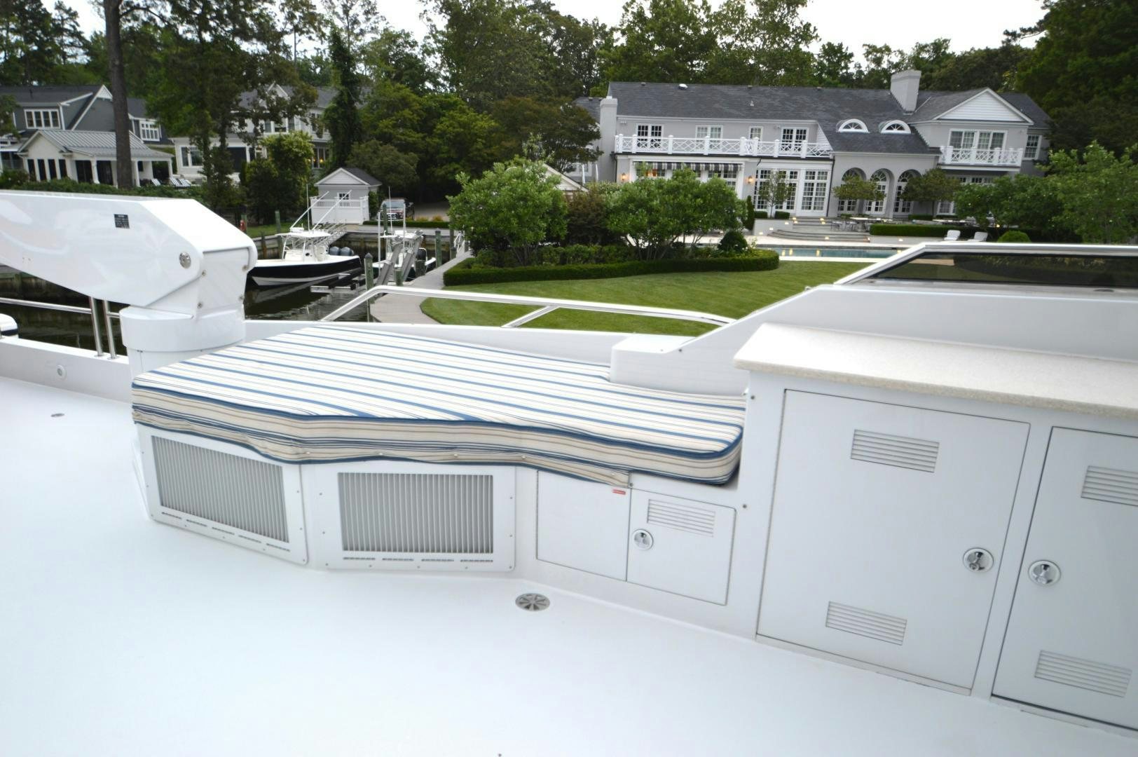 a white house with a pool aboard MARBRI Yacht for Sale