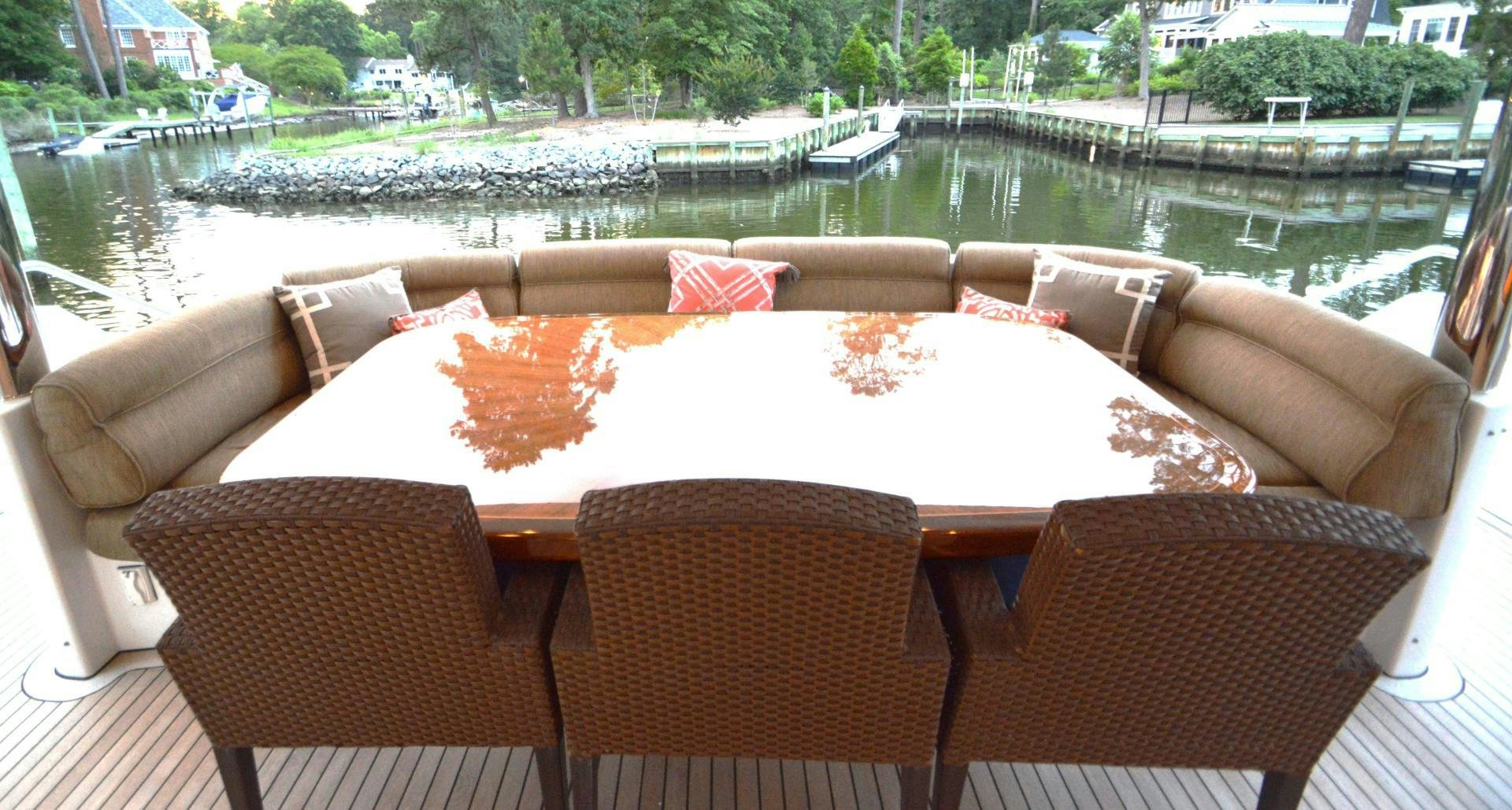 a table with chairs around it aboard MARBRI Yacht for Sale