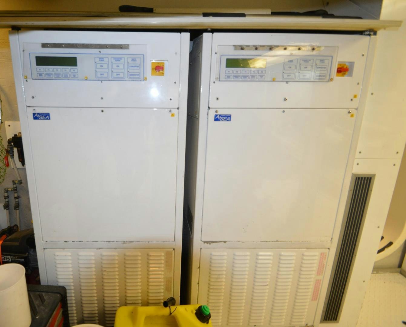 a white machine with a yellow plastic tube on the front aboard MARBRI Yacht for Sale