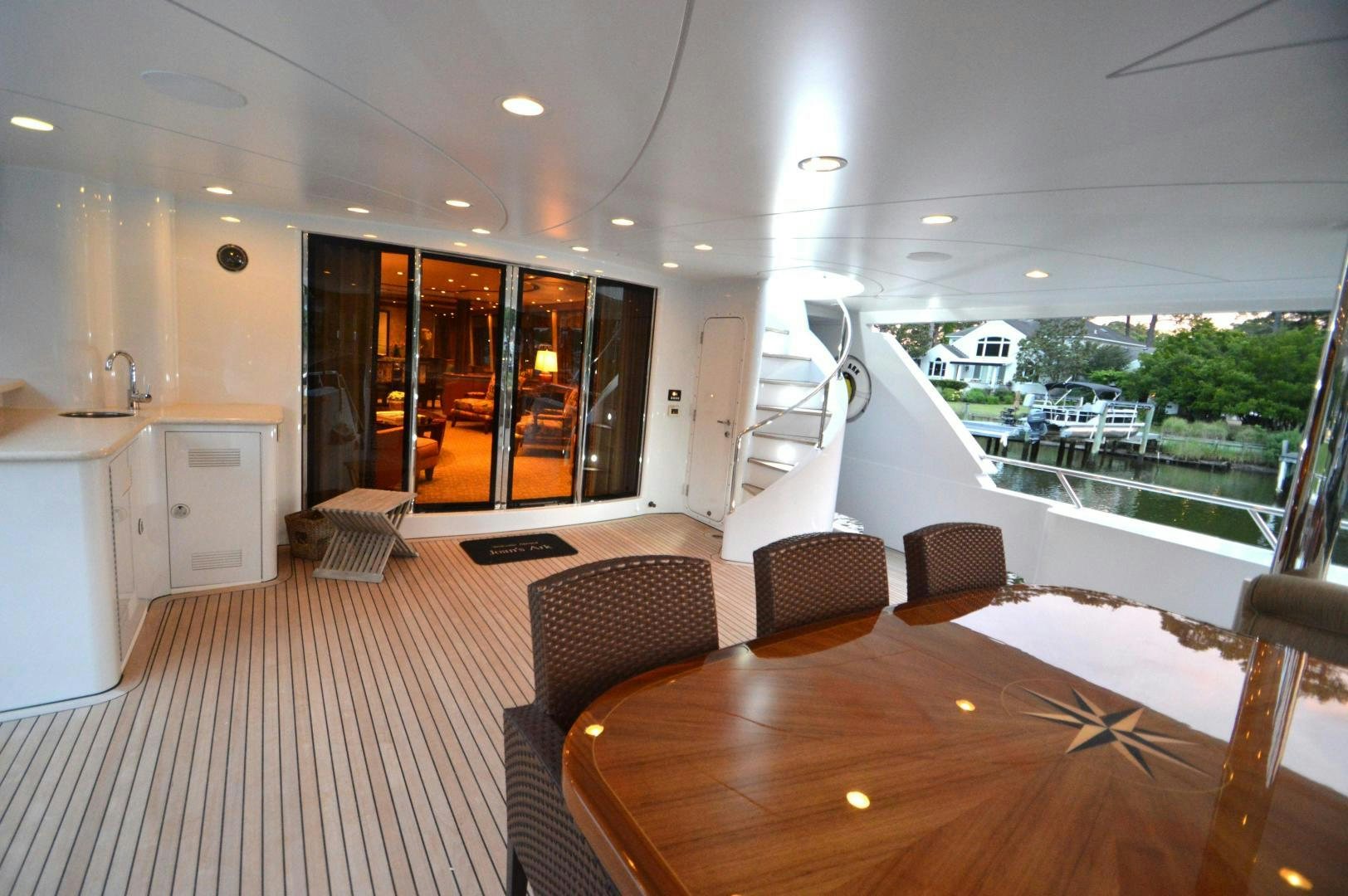 a large open space with a table and chairs and a large window aboard MARBRI Yacht for Sale