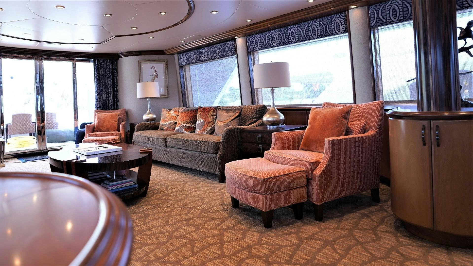 a living room with a couch and a table aboard MARBRI Yacht for Sale