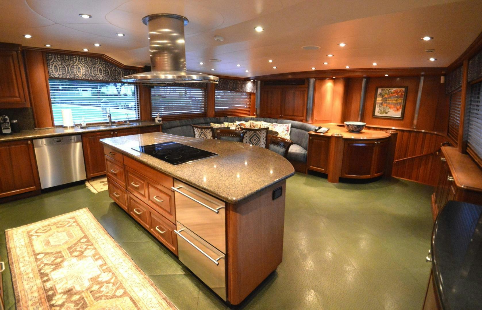 a large kitchen with a large island aboard MARBRI Yacht for Sale