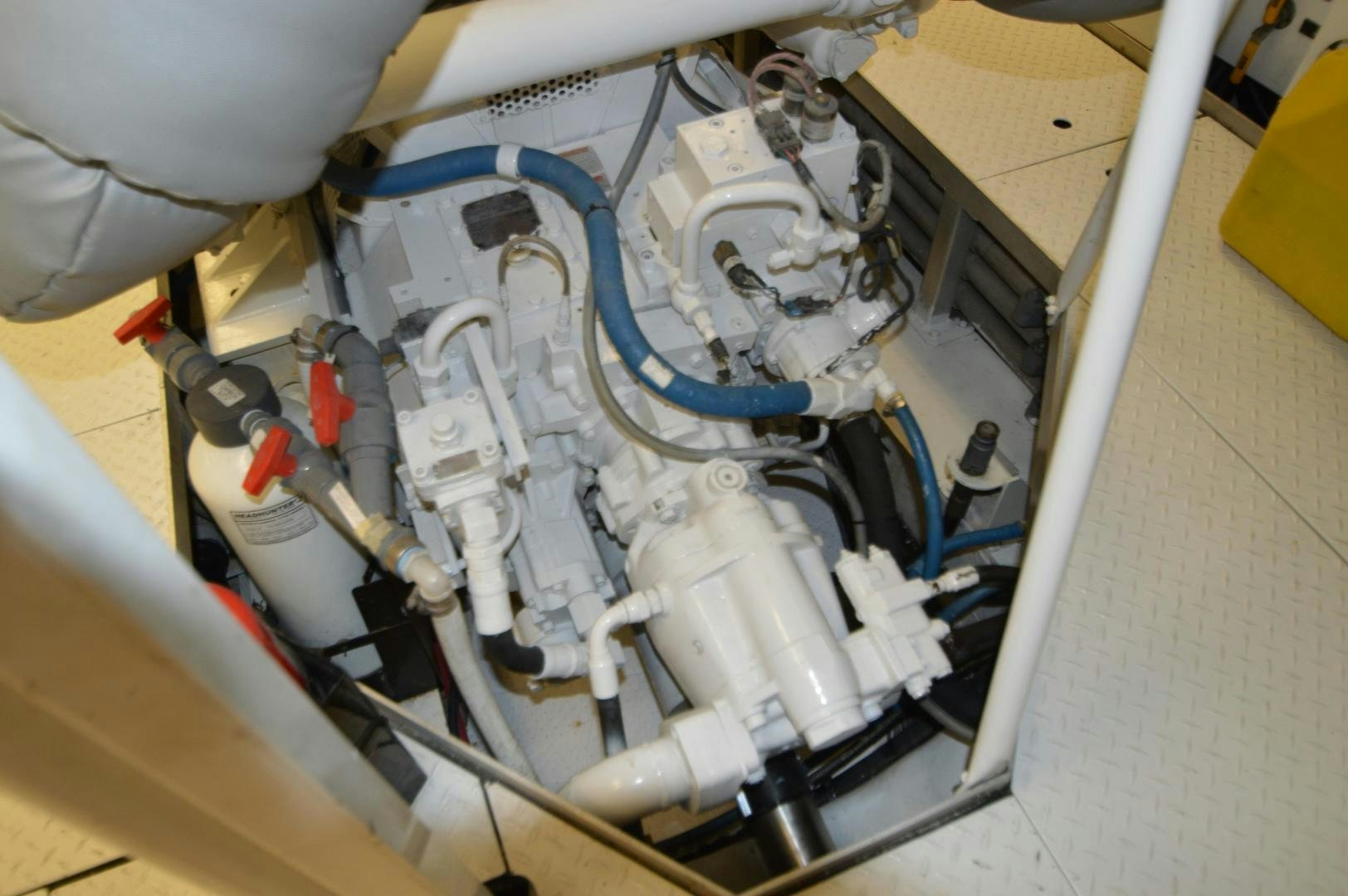 a white car engine aboard MARBRI Yacht for Sale
