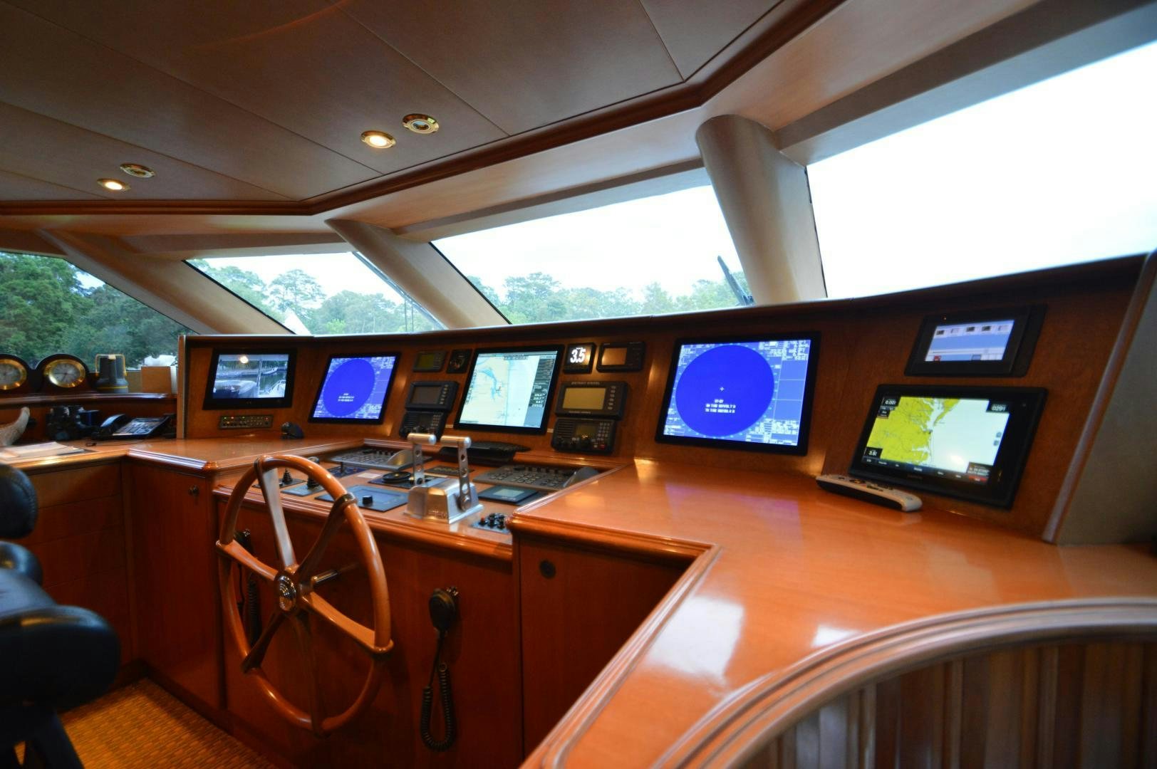 a room with many monitors and computers aboard MARBRI Yacht for Sale