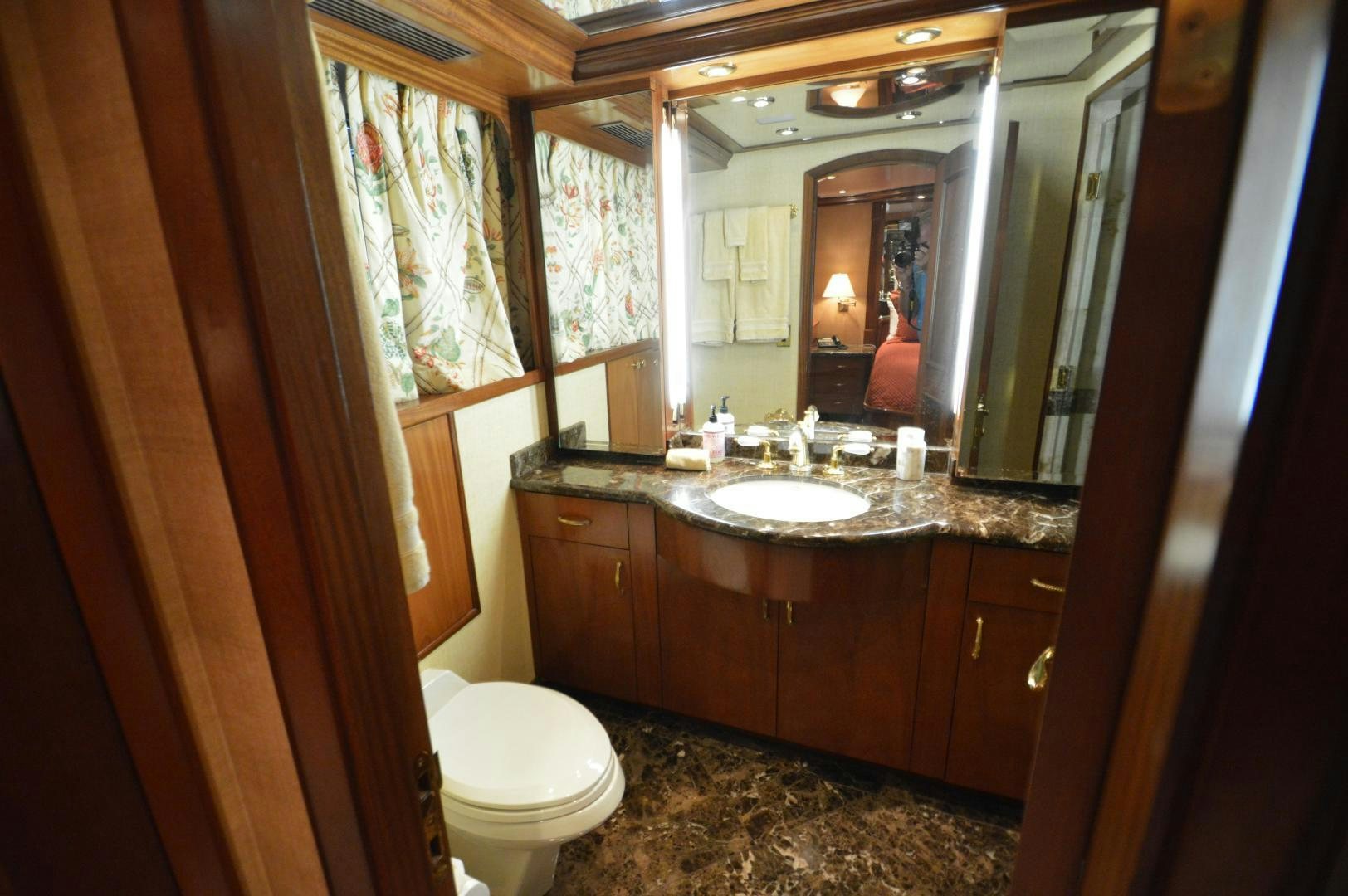 a bathroom with a large mirror aboard MARBRI Yacht for Sale