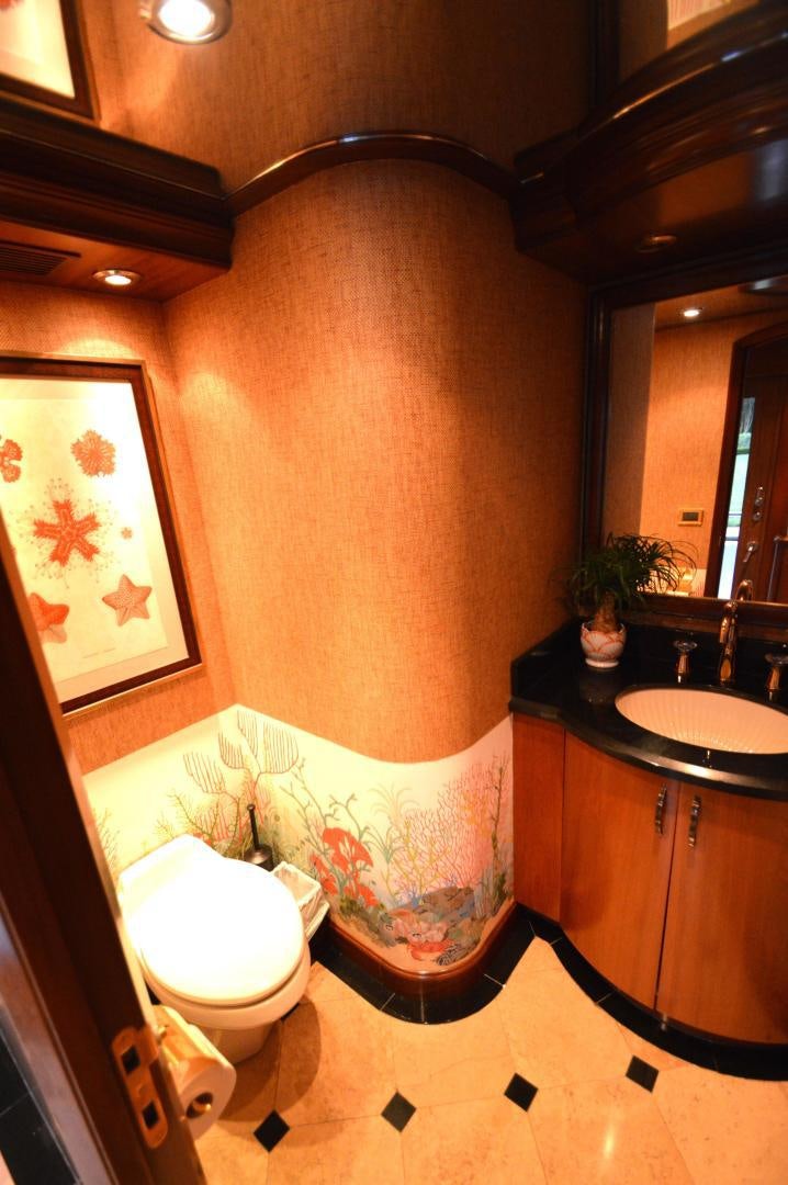 a bathroom with a bathtub and toilet aboard MARBRI Yacht for Sale