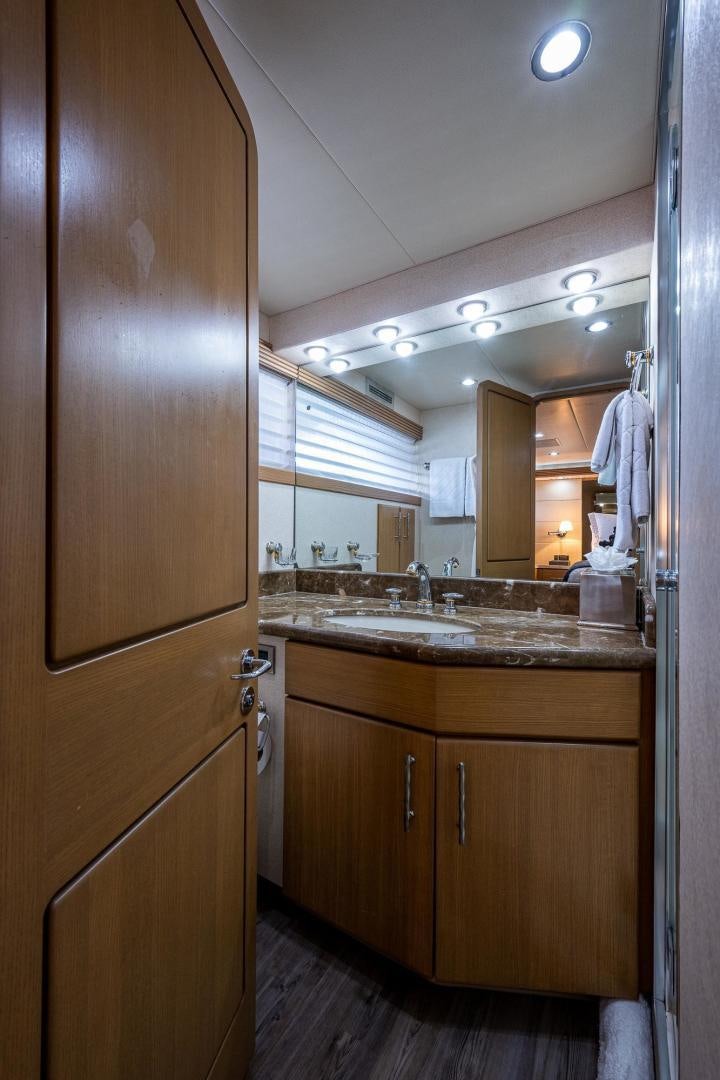 a bathroom with a wood cabinet aboard ATLANTIC Yacht for Sale