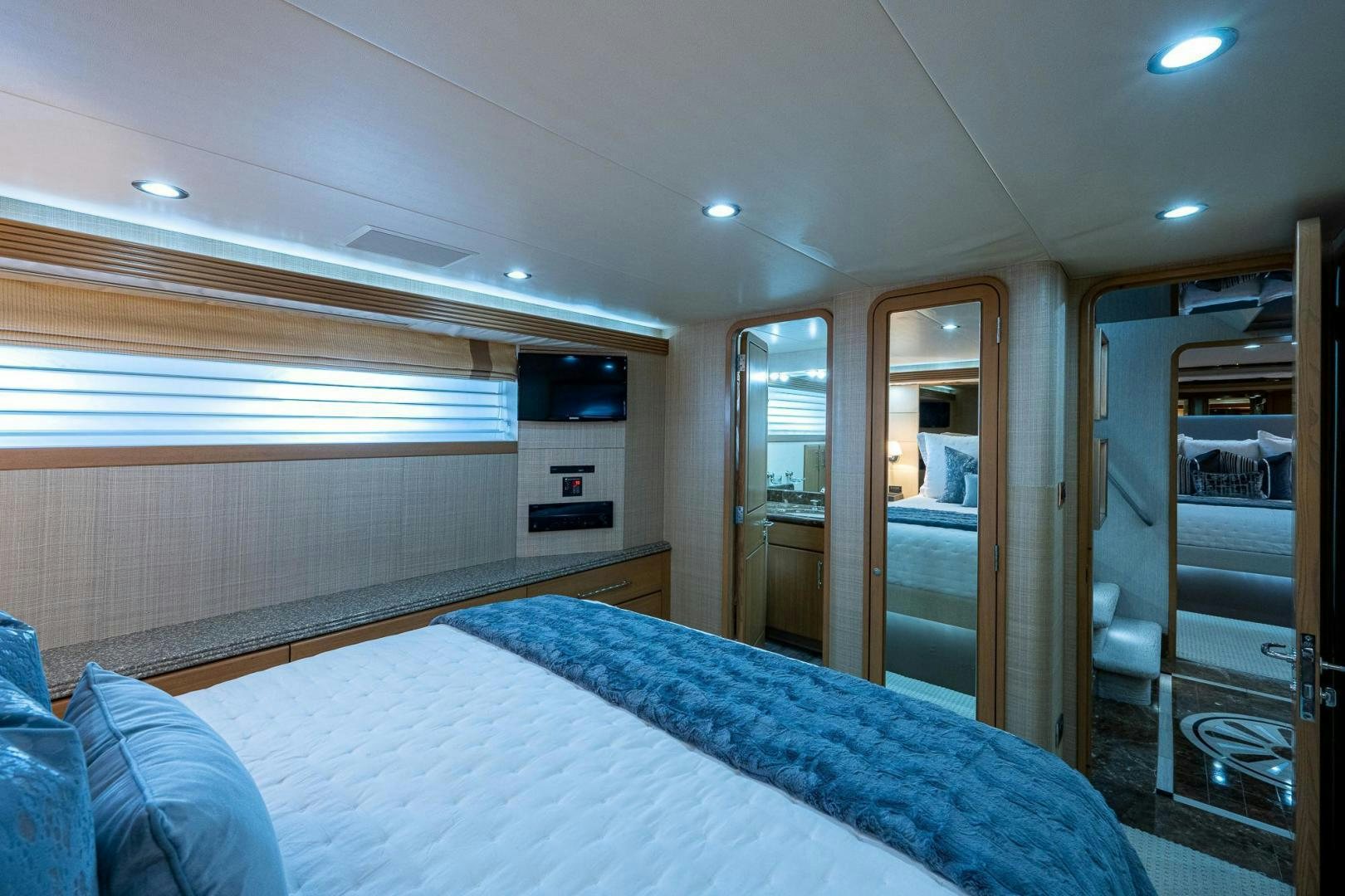 a bedroom with a bed and a mirror aboard ATLANTIC Yacht for Sale