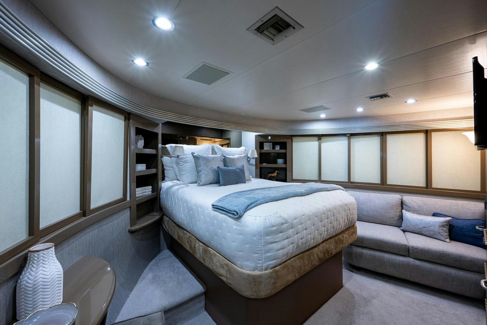 a bedroom with a bed and a couch aboard ATLANTIC Yacht for Sale