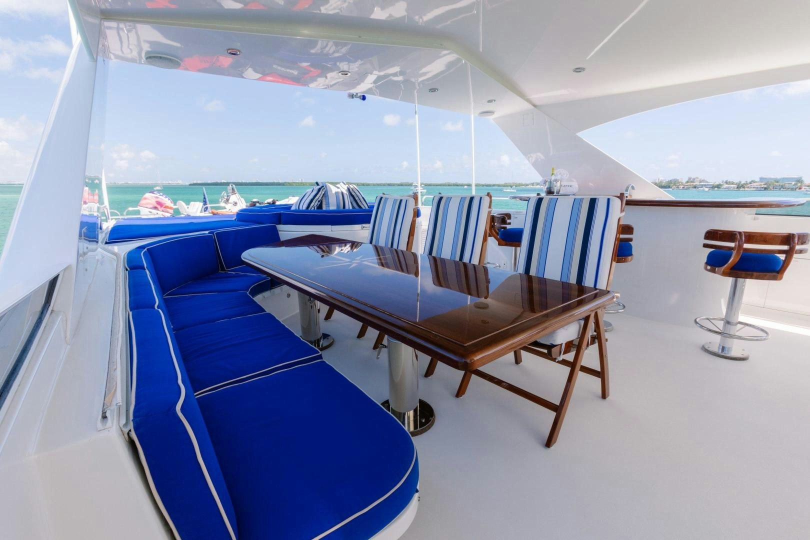 a table with chairs on it aboard ATLANTIC Yacht for Sale