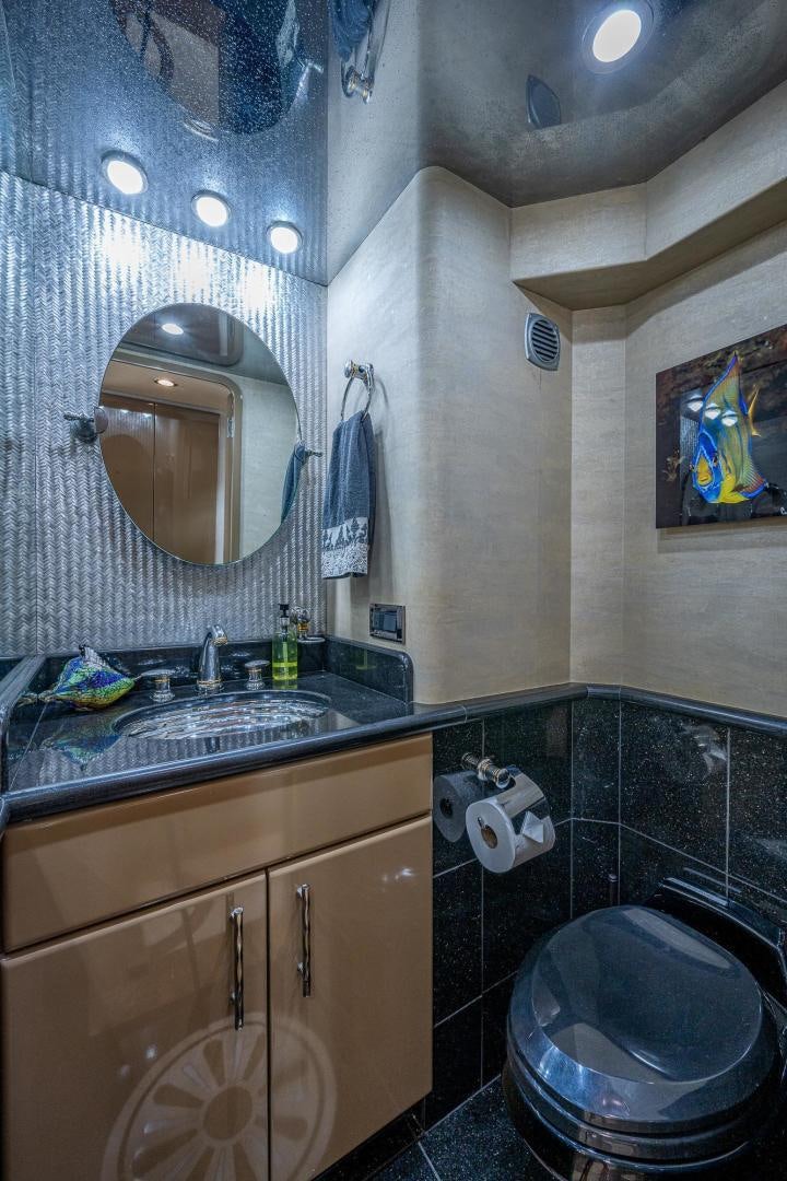 a bathroom with a toilet and a sink aboard ATLANTIC Yacht for Sale