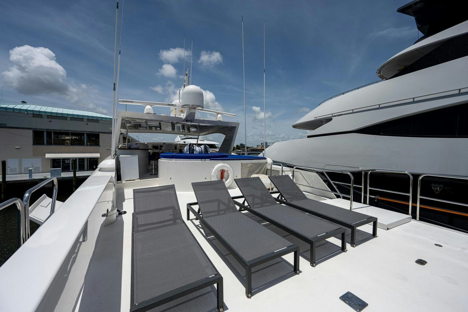 a deck with chairs and a boat aboard ATLANTIC Yacht for Sale