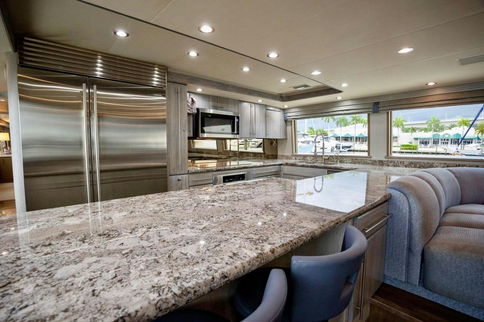 a large kitchen with a large marble table aboard ATLANTIC Yacht for Sale