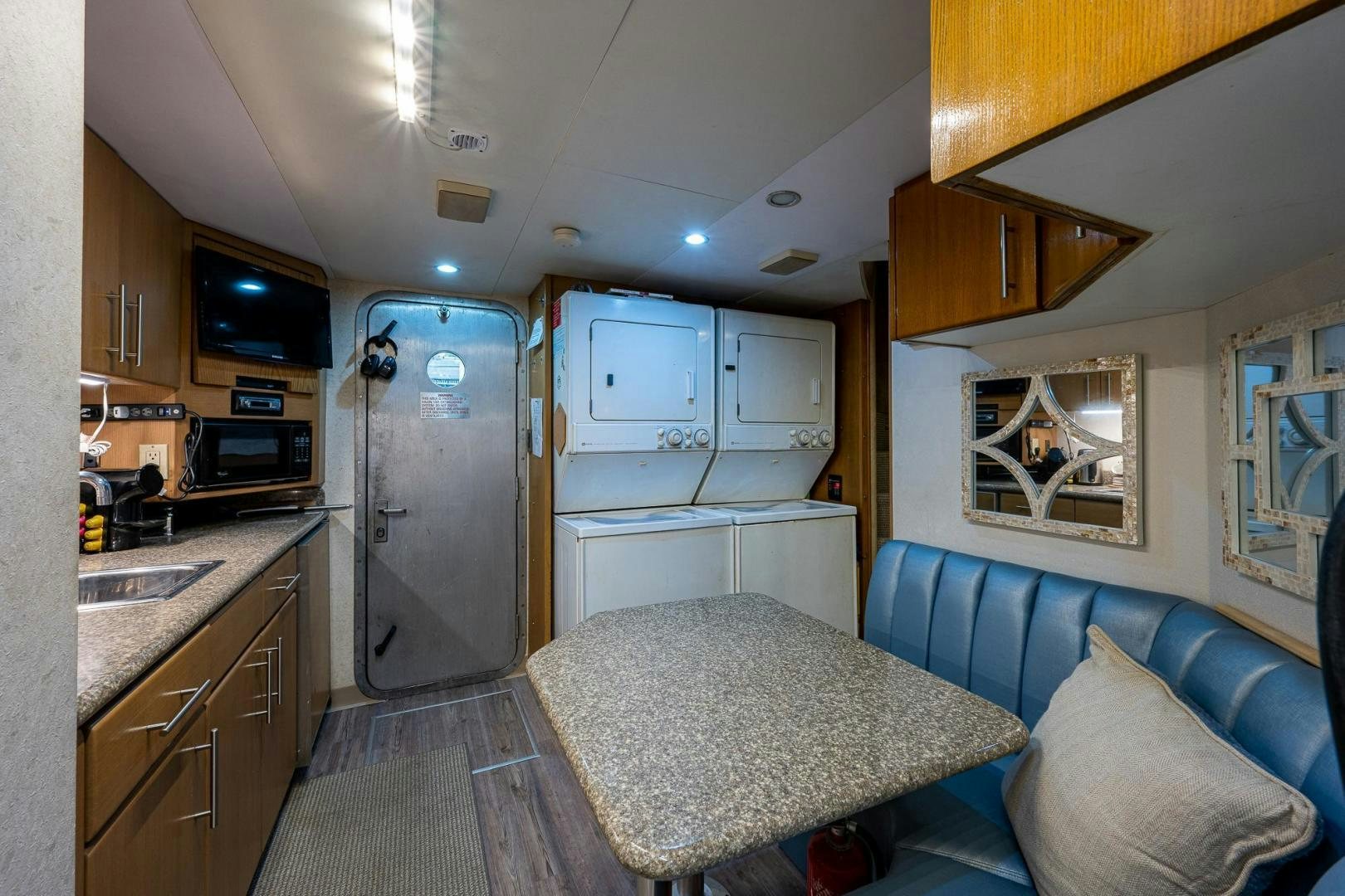 a small kitchen with a couch aboard ATLANTIC Yacht for Sale