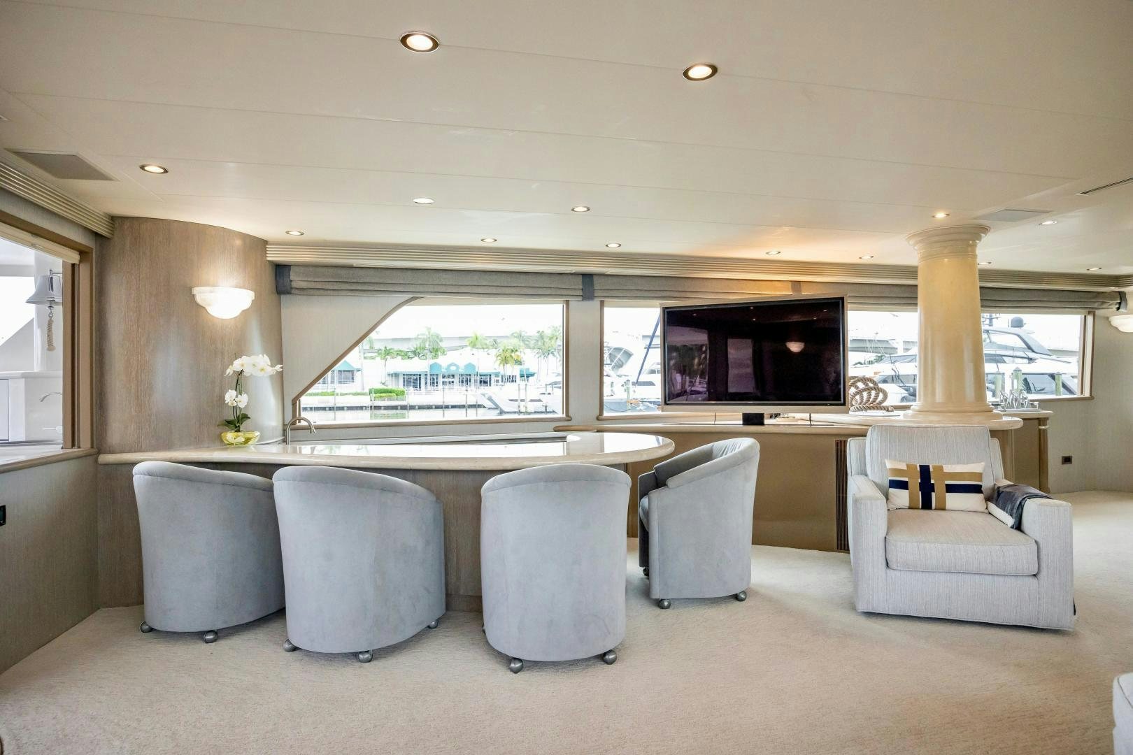 a large white and beige room with a large window and a large table aboard ATLANTIC Yacht for Sale