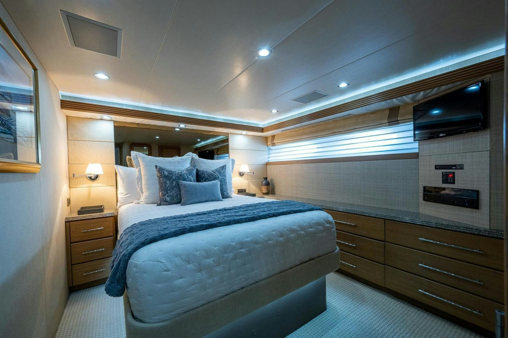 a bedroom with a bed and a television aboard ATLANTIC Yacht for Sale