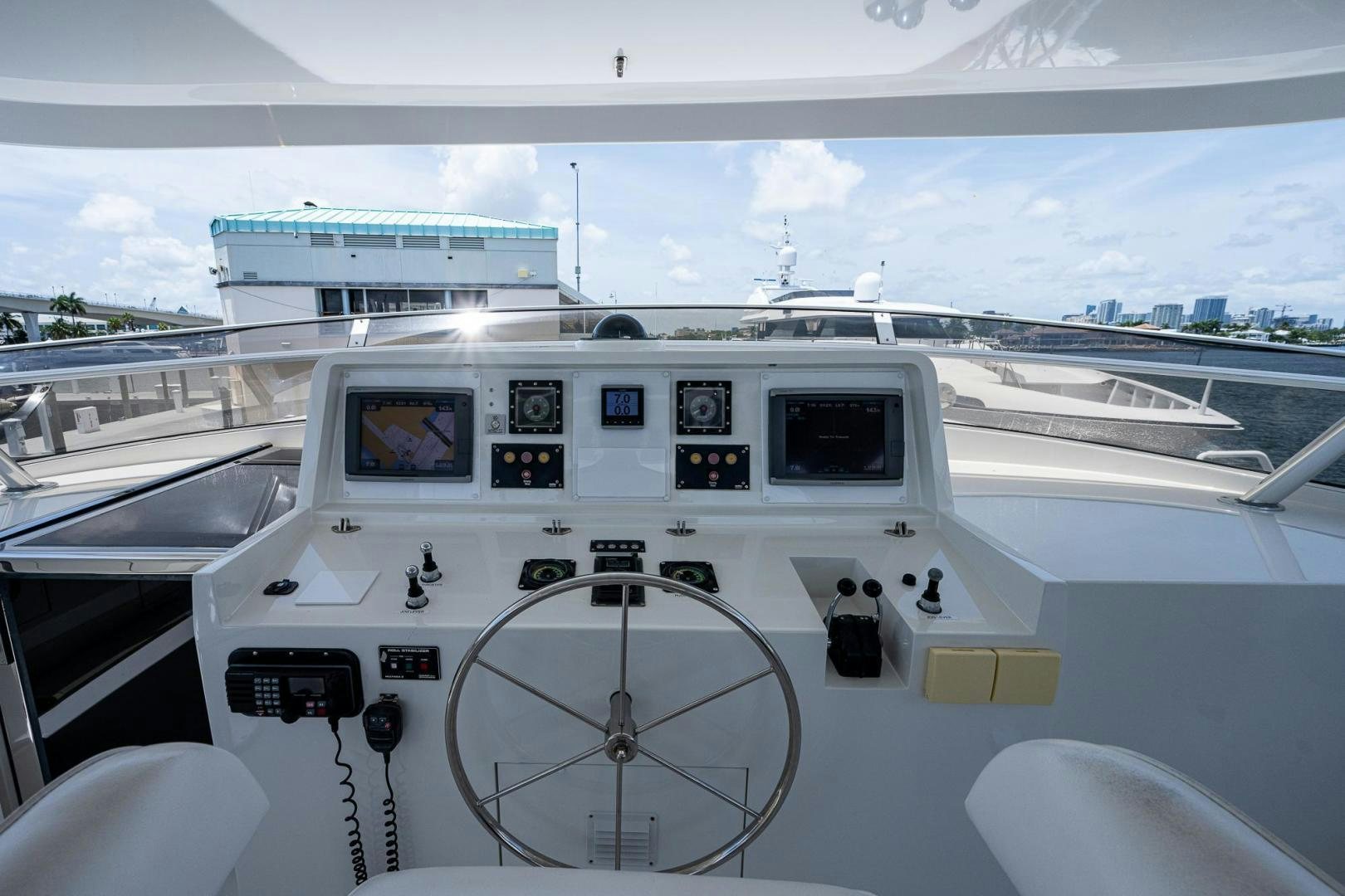 a white boat on a body of water aboard ATLANTIC Yacht for Sale
