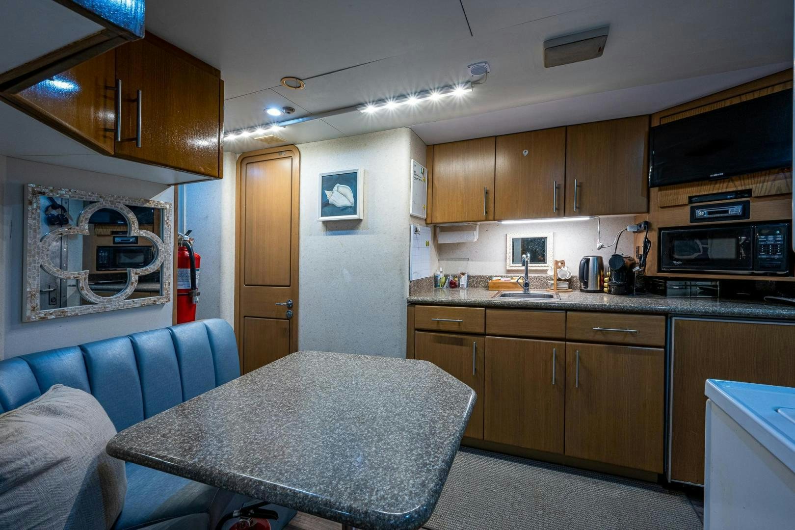 a living room with a couch and a table aboard ATLANTIC Yacht for Sale