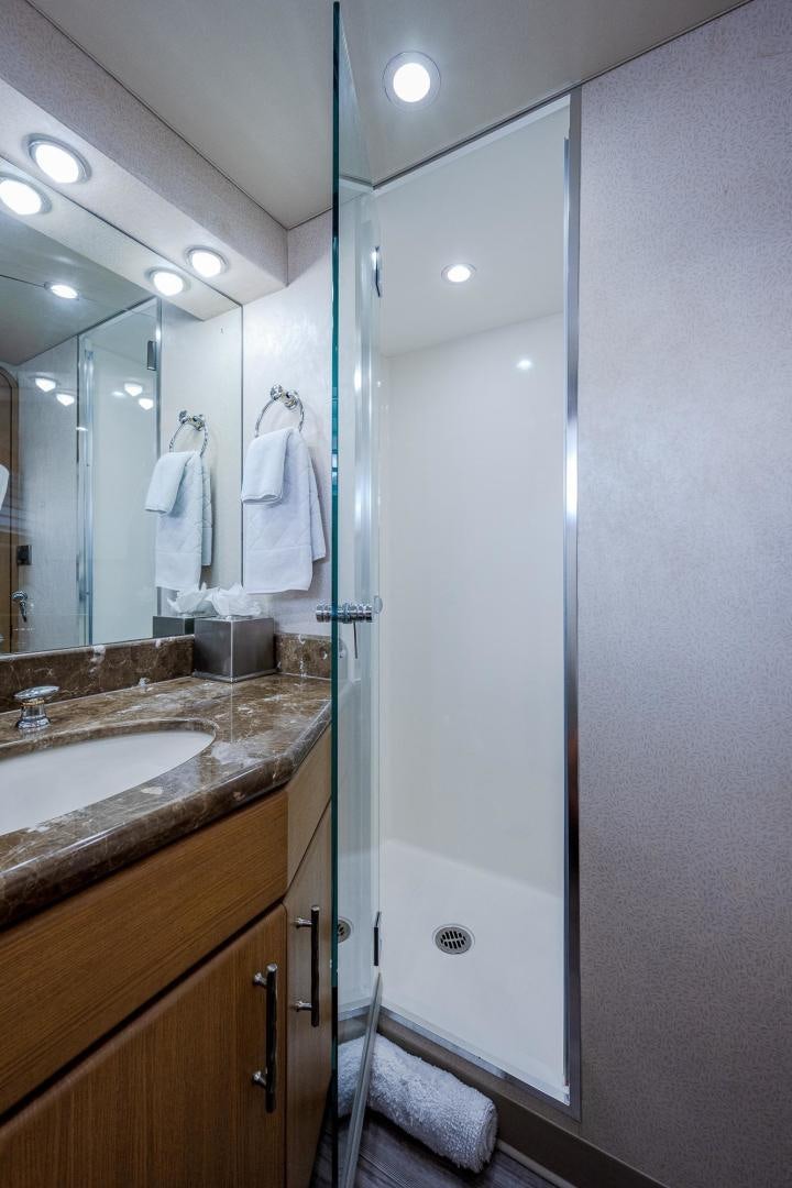 a bathroom with a glass shower aboard ATLANTIC Yacht for Sale