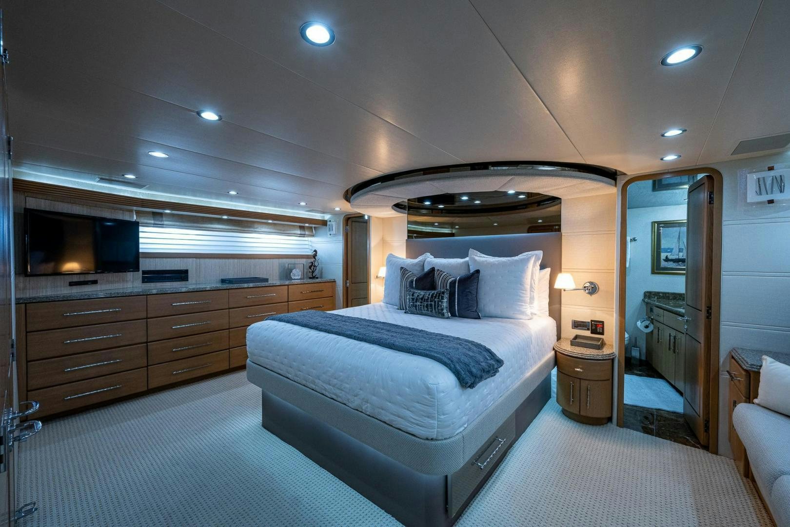 a bedroom with a bed and a dresser aboard ATLANTIC Yacht for Sale