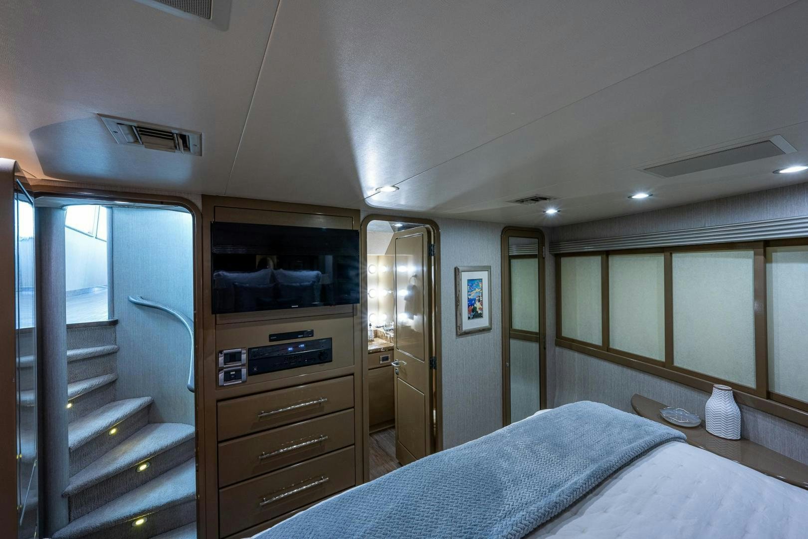 a bedroom with a closet and a bed aboard ATLANTIC Yacht for Sale