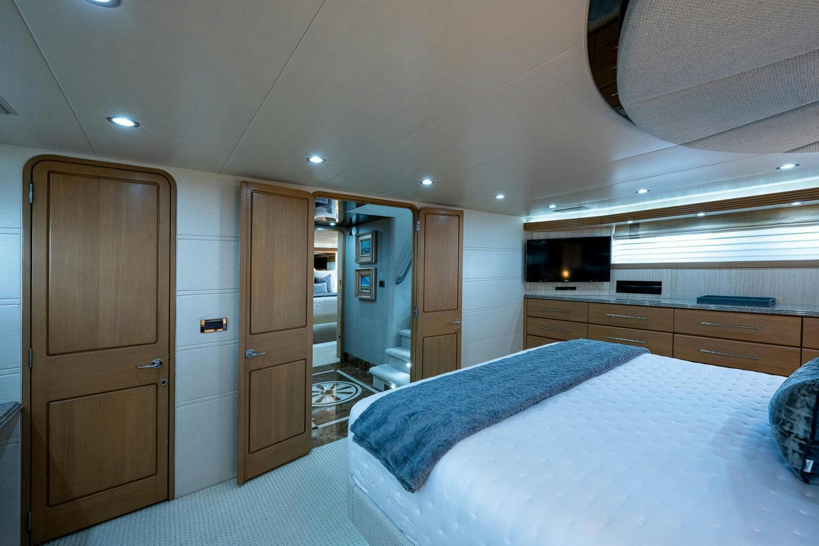 a bedroom with a bed and a closet aboard ATLANTIC Yacht for Sale