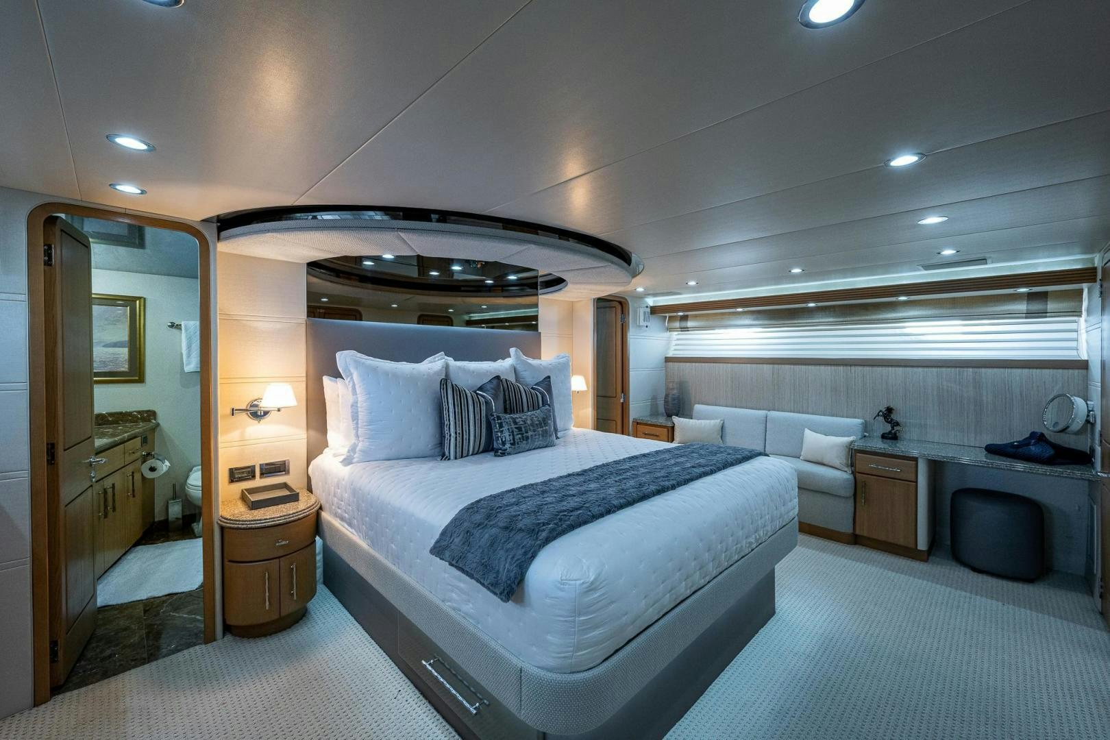 a bedroom with a bed and a desk aboard ATLANTIC Yacht for Sale