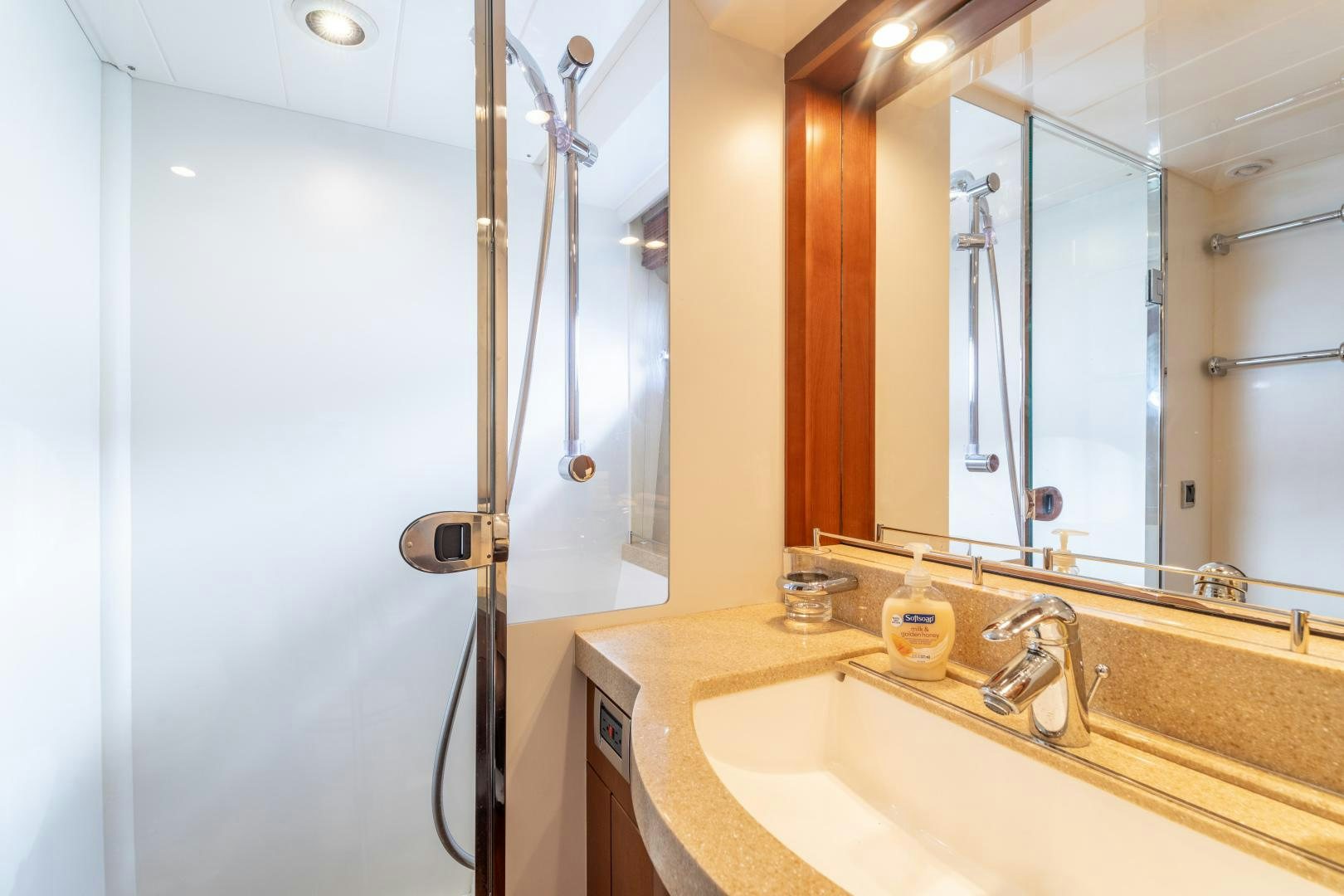 a bathroom with a sink and shower aboard AMNESIA Yacht for Sale