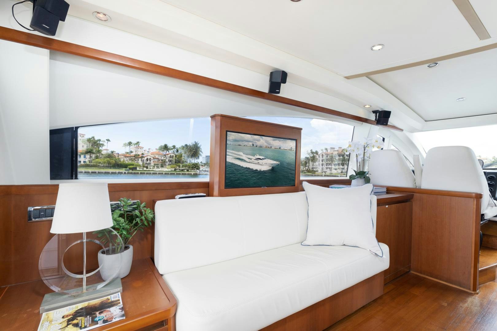 a room with a couch and a table and a window aboard AMNESIA Yacht for Sale