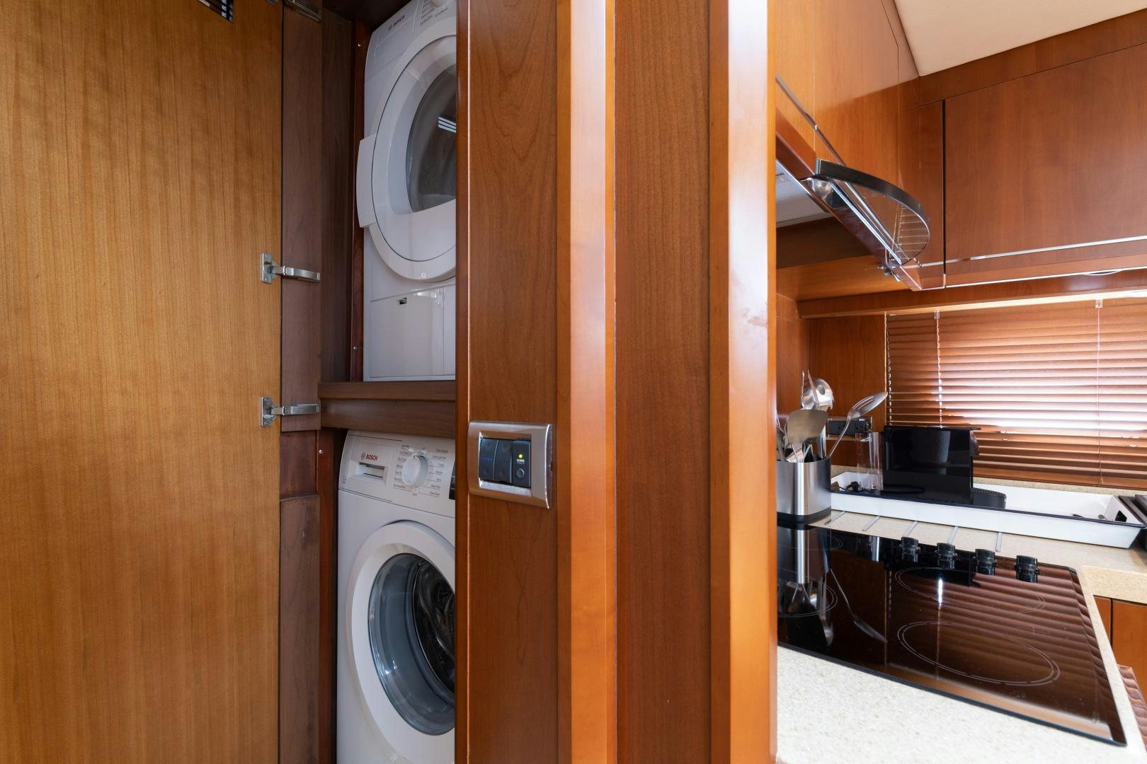 a room with a washing machine and dryer aboard AMNESIA Yacht for Sale