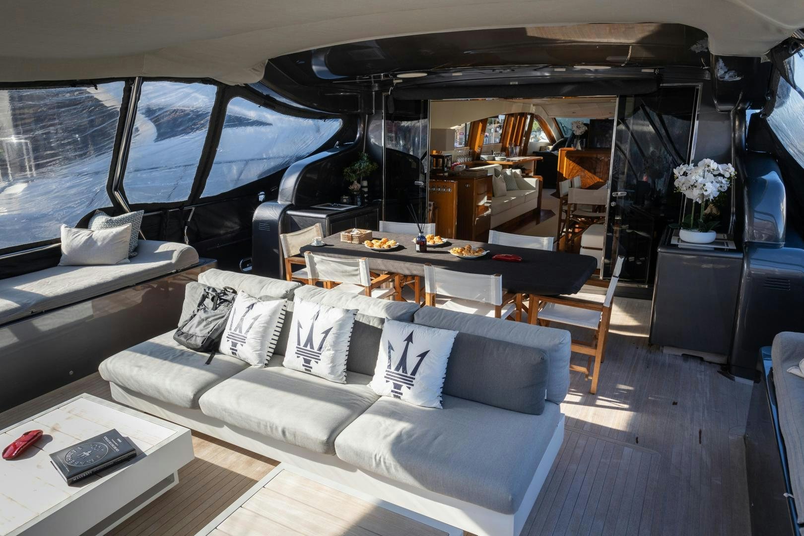 a room with a bed and a table aboard OSE Yacht for Sale