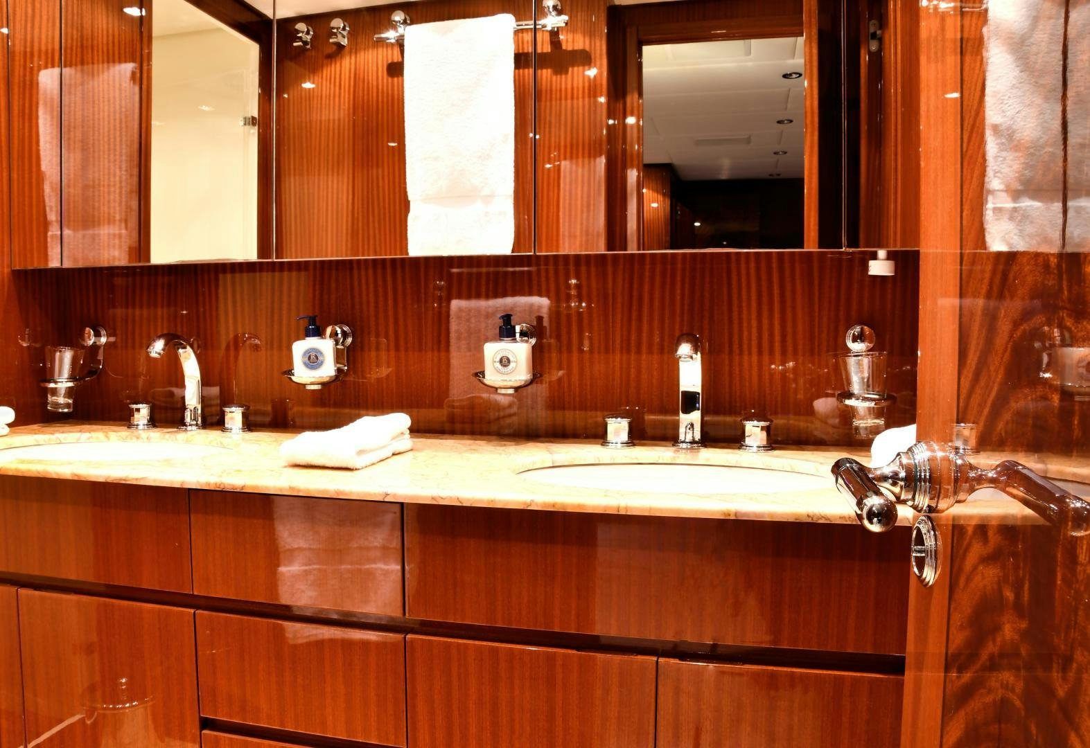 a bathroom with a large mirror aboard OSE Yacht for Sale