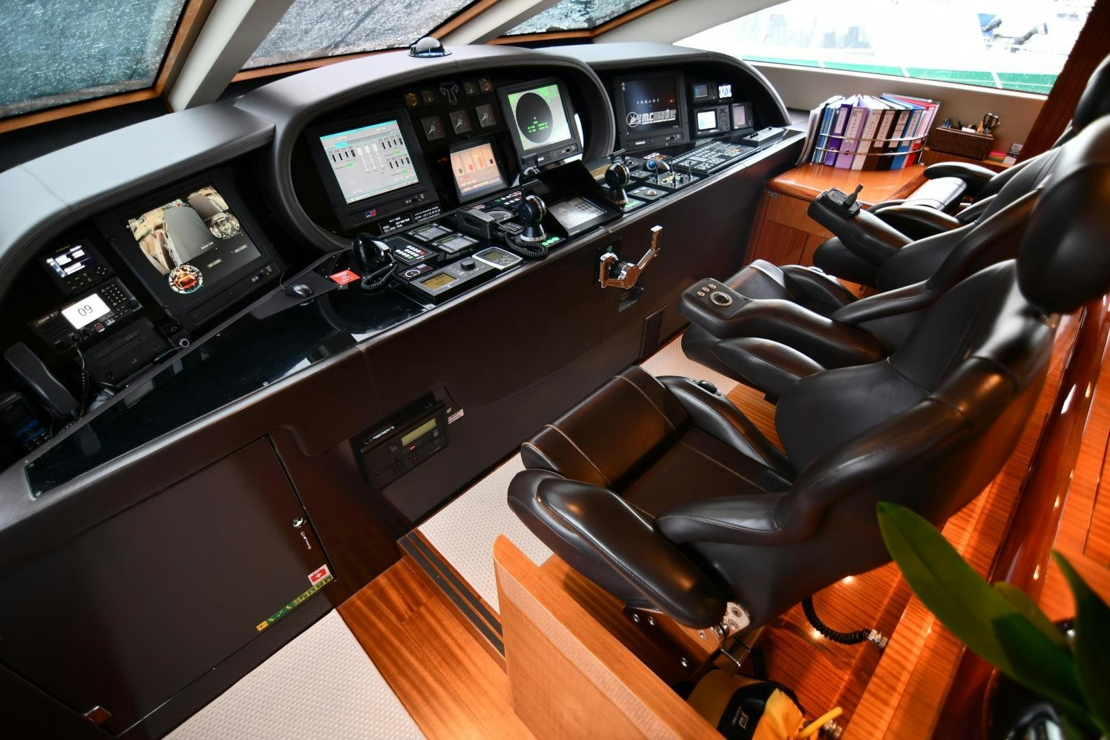 a room with a desk and chairs aboard OSE Yacht for Sale