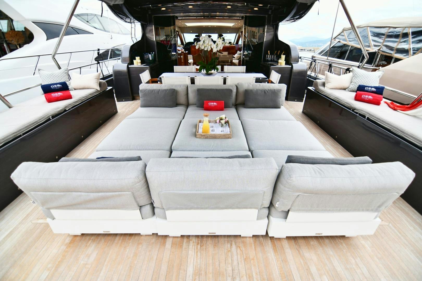 a living room with a couch and a table aboard OSE Yacht for Sale