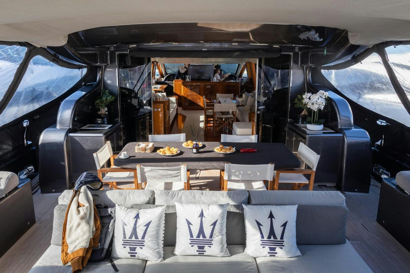 a dining room with a table and chairs aboard OSE Yacht for Sale