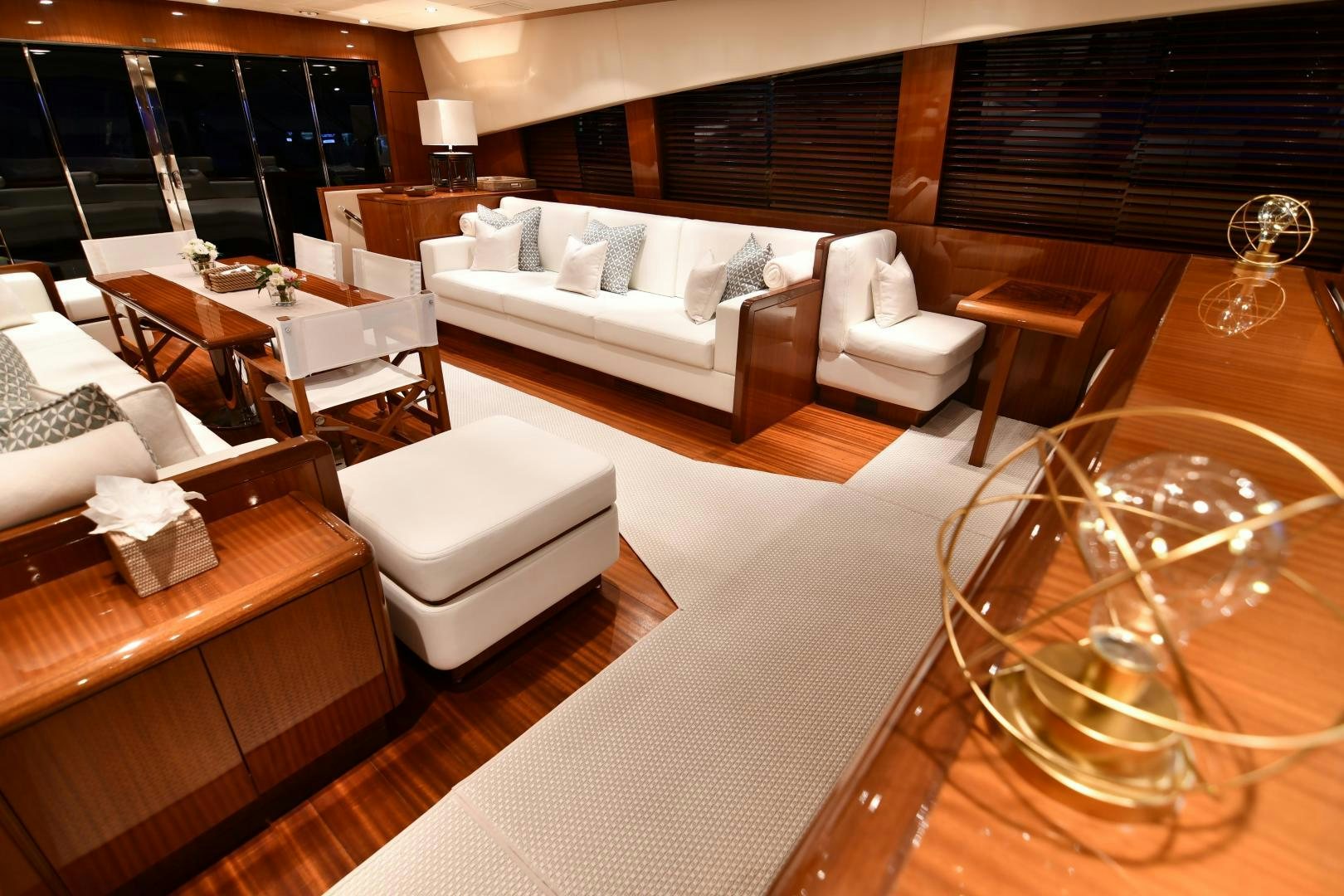a living room with a large window aboard OSE Yacht for Sale