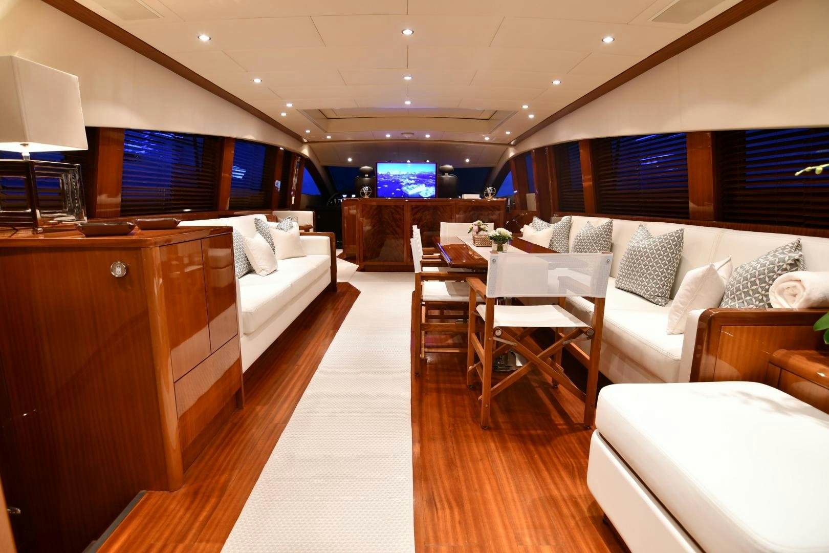 a room with a couch and a television aboard OSE Yacht for Sale