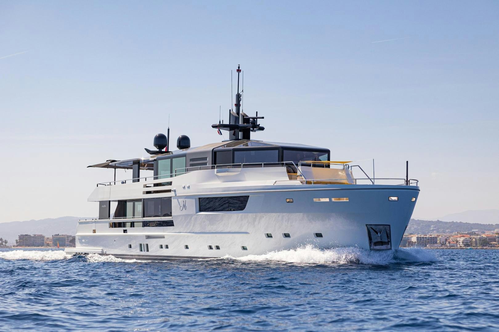 a large white boat aboard M Yacht for Sale