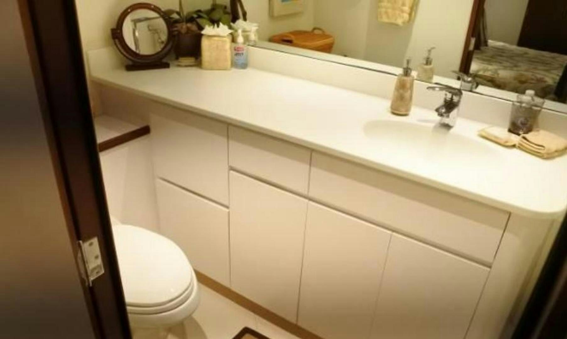 a bathroom with a sink and toilet aboard MY LADY ALASKA Yacht for Sale
