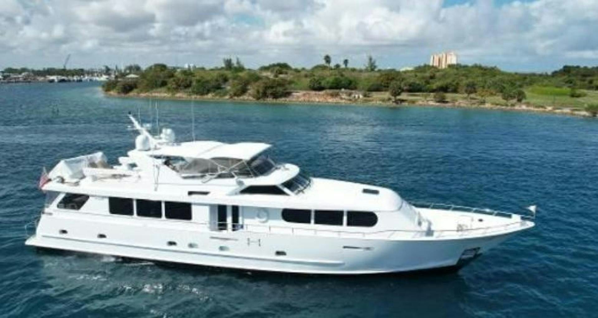 a white yacht in the water aboard MY LADY ALASKA Yacht for Sale