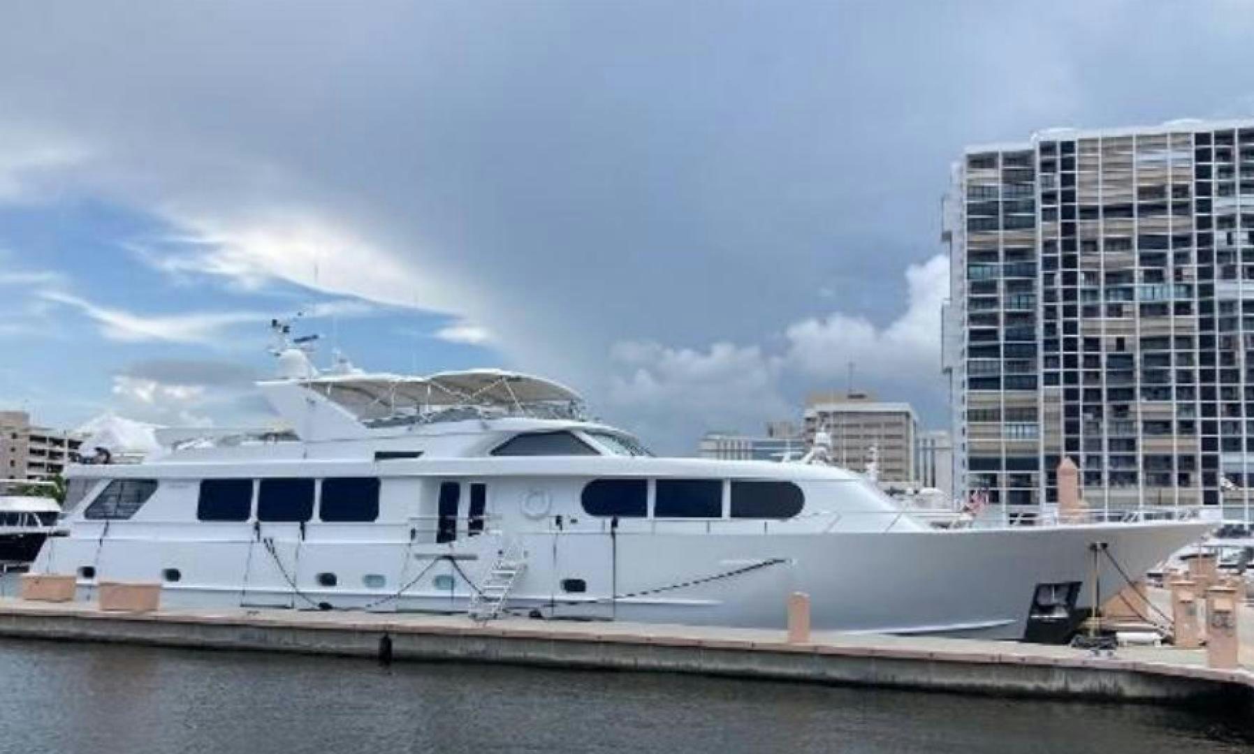 a white boat in a harbor aboard MY LADY ALASKA Yacht for Sale