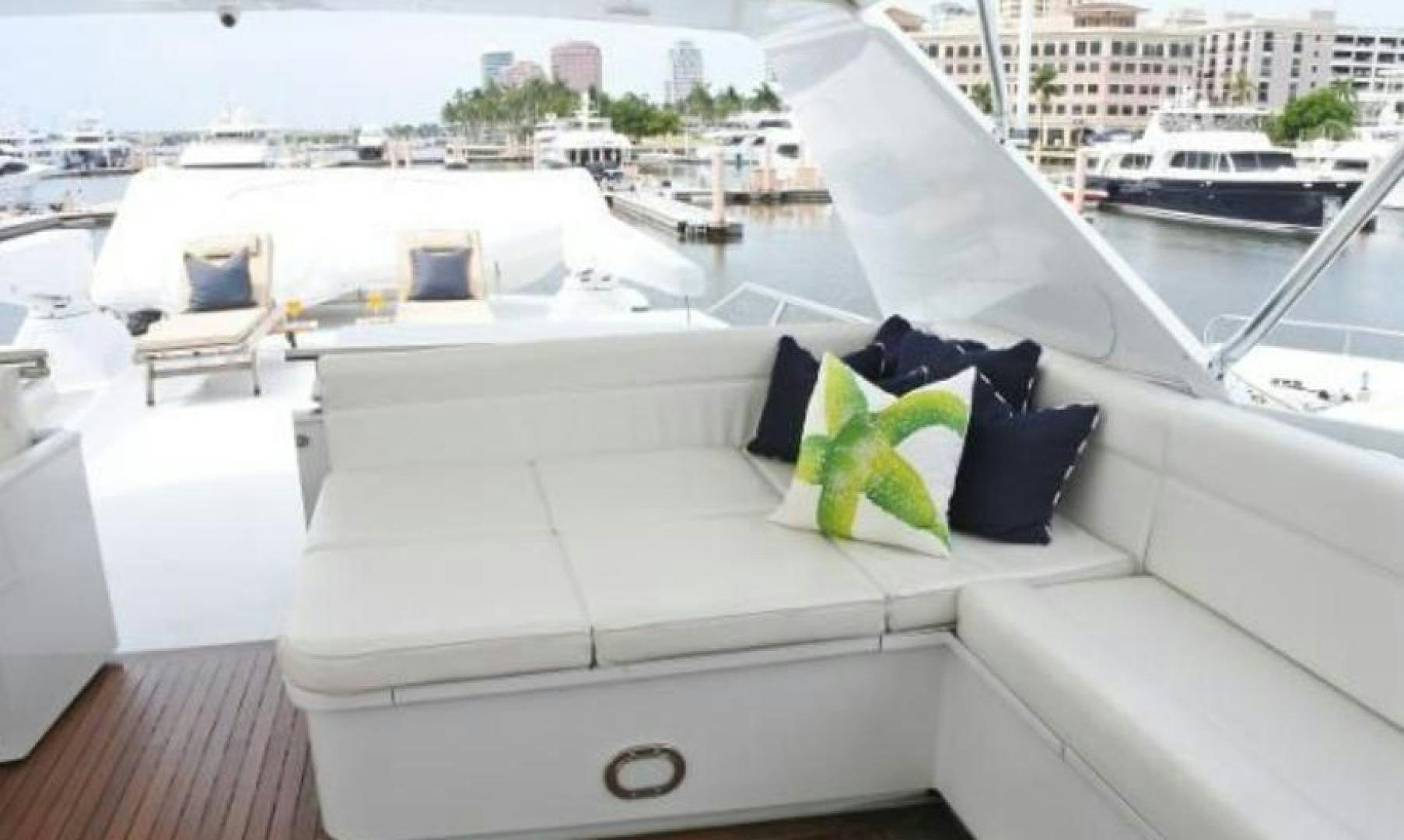 a white yacht with green leaves aboard MY LADY ALASKA Yacht for Sale