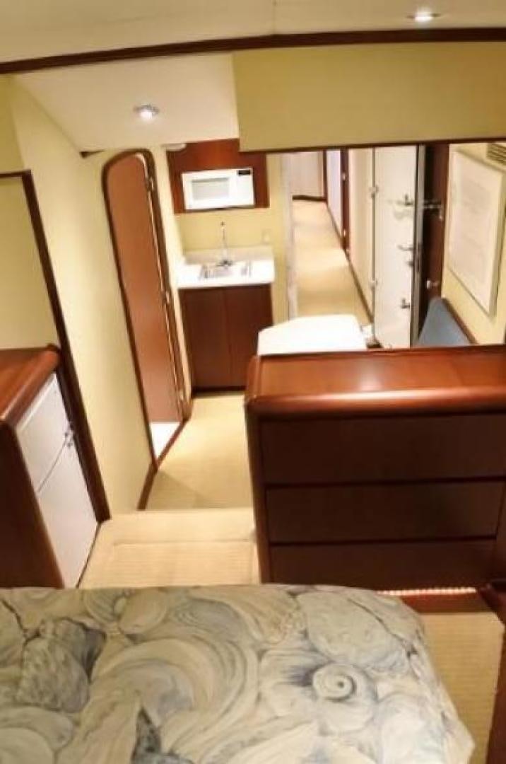 a dog lying on a bed aboard MY LADY ALASKA Yacht for Sale